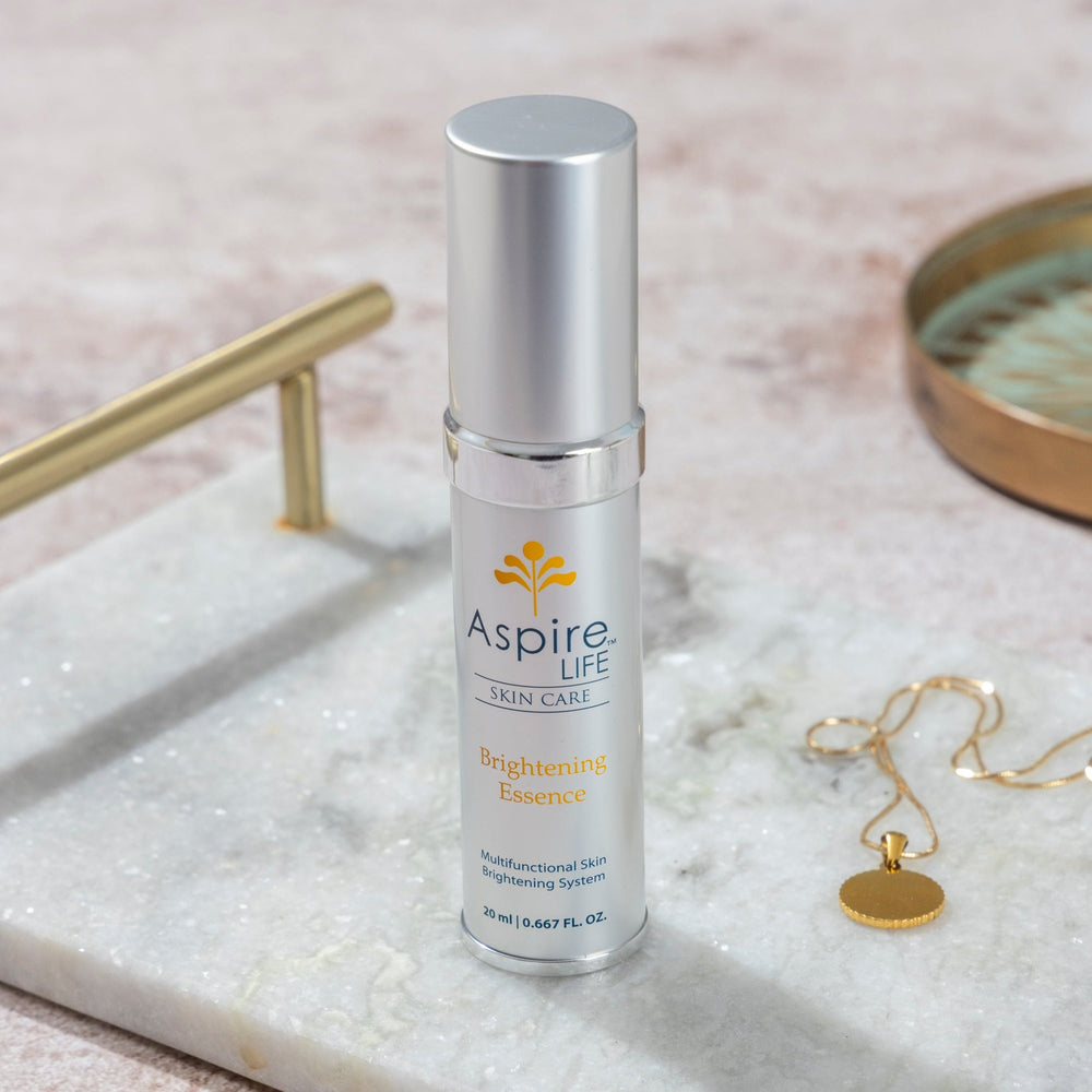 AspireLIFE® Brightening Essence – skin brightening moisturizer with Vitamin C, licorice root, and marine actives to reduce discoloration.