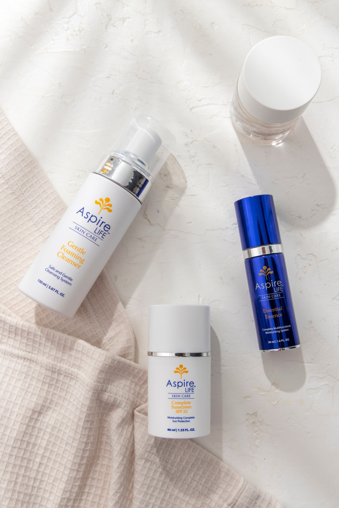 AspireLIFE® Essential Series – simplified daily skincare essentials to hydrate, nourish, and support healthy skin.